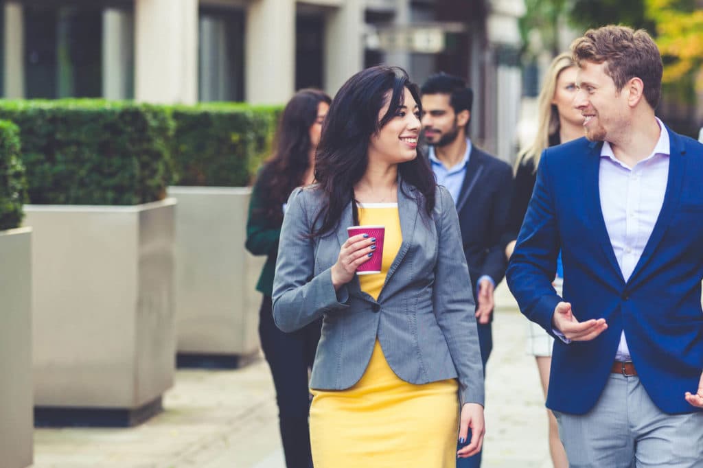 Young colleagues walking together